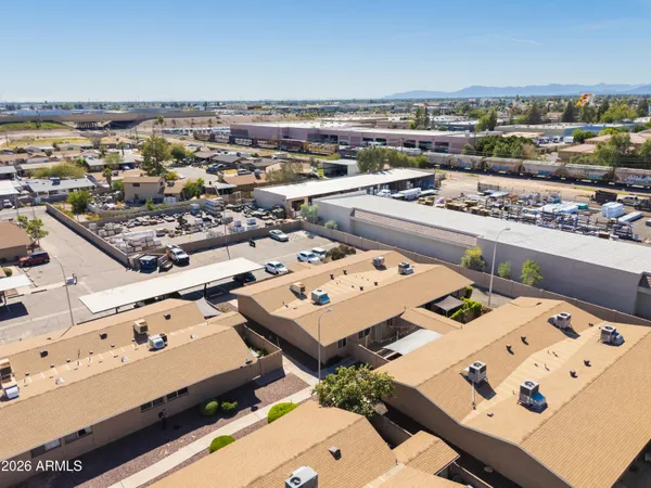an aerial view of a house with a yard