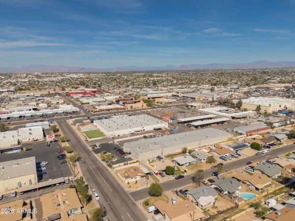an aerial view of residential house with parking