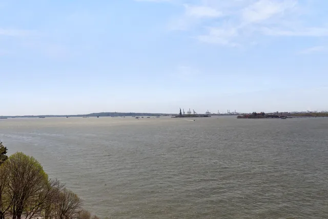 a view of swimming pool with outdoor seating and city view