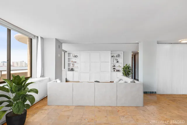 a dining room with a large window and table