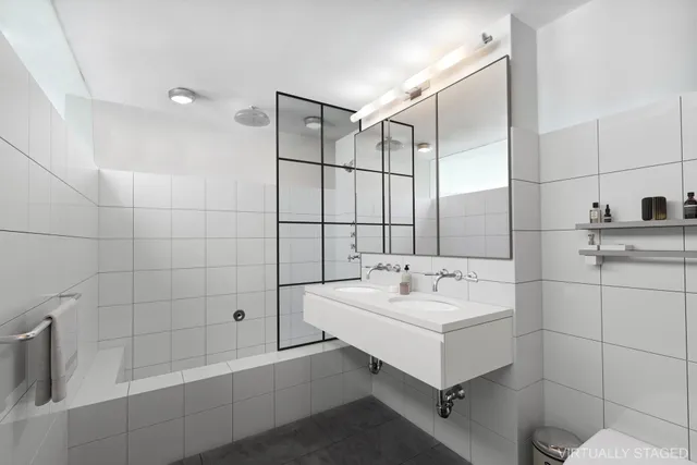 a living room with furniture and potted plant