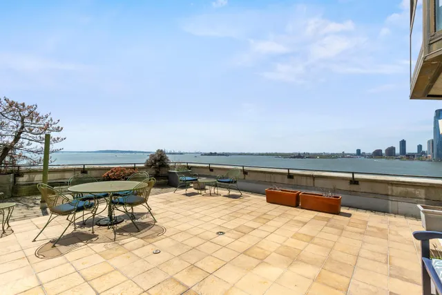 a bathroom with a sink mirror and shower