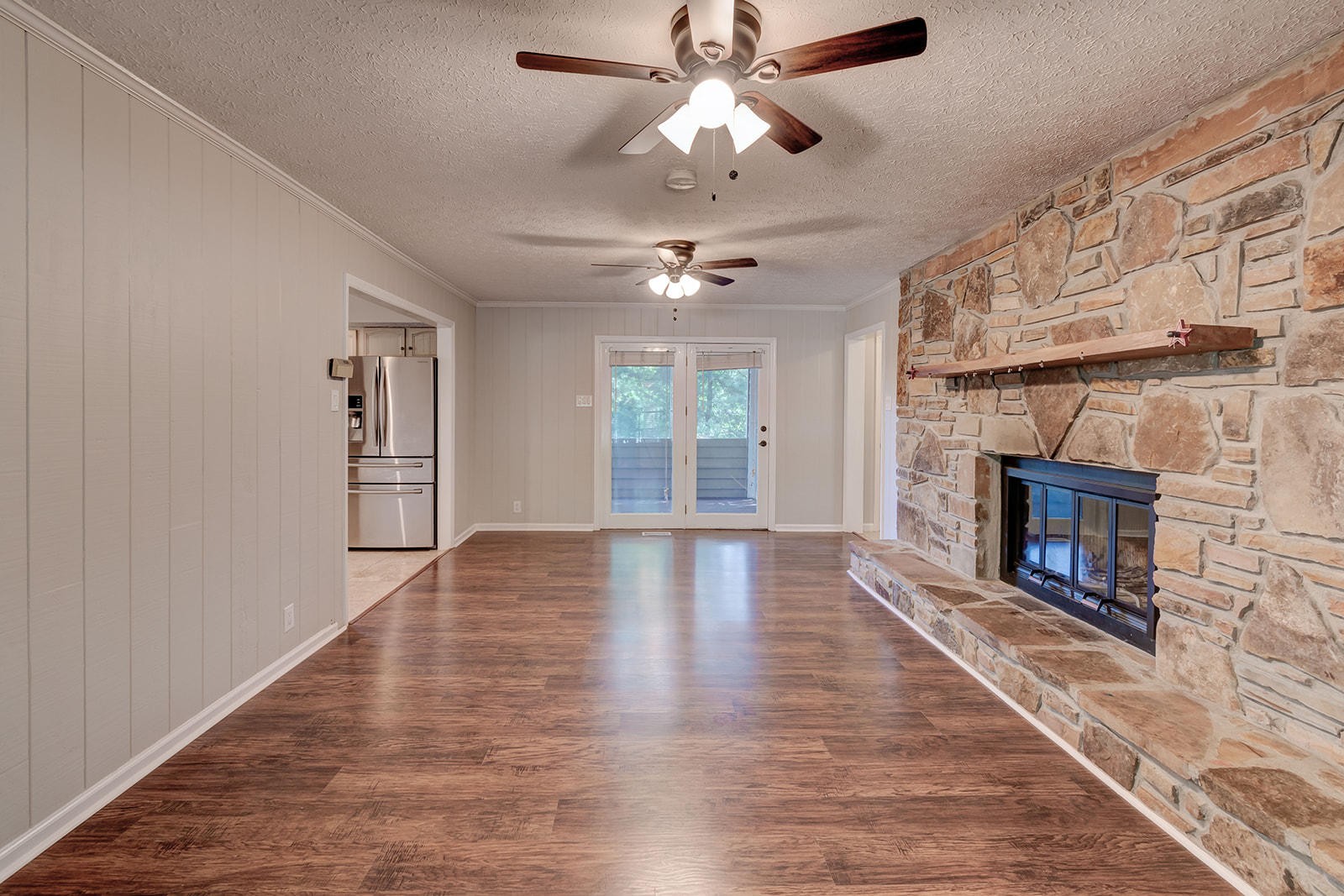 502 Rolling Creek Road Knoxville, TN 37934 - Photo 11 of 27 a view of an empty room with wooden floor fireplace and a window
