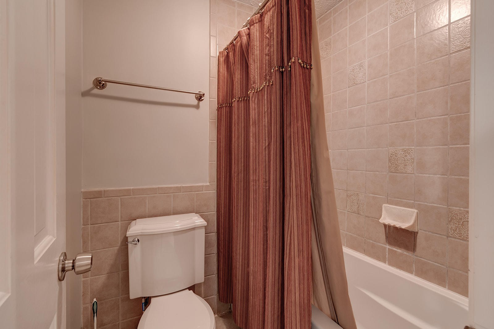 502 Rolling Creek Road Knoxville, TN 37934 - Photo 13 of 27 a white toilet sitting next to a bathroom sink