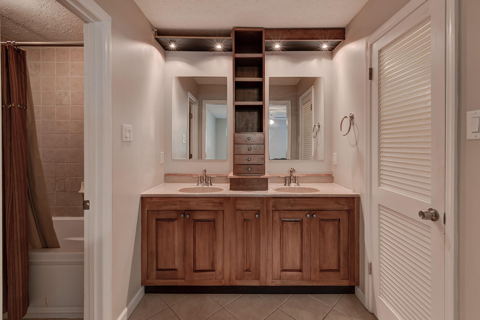 502 Rolling Creek Road Knoxville, TN 37934 - Photo 14 of 27 a bathroom with a granite countertop sink a mirror and a shower