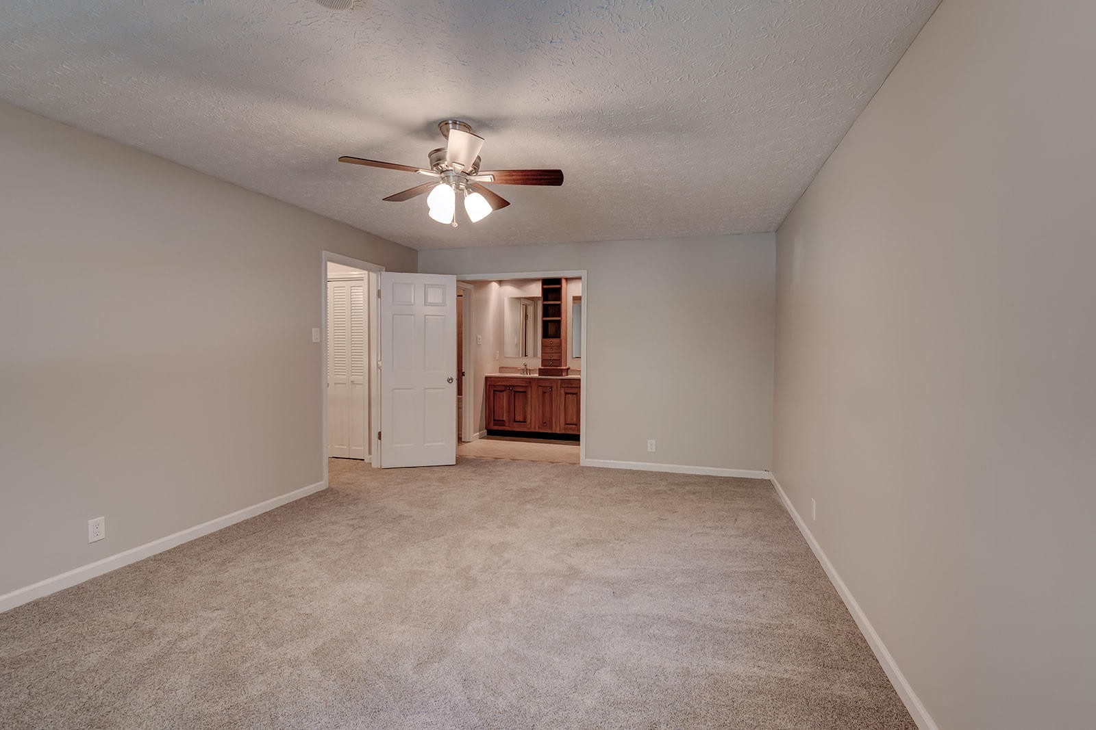 502 Rolling Creek Road Knoxville, TN 37934 - Photo 16 of 27 an empty room with chandelier fan and windows