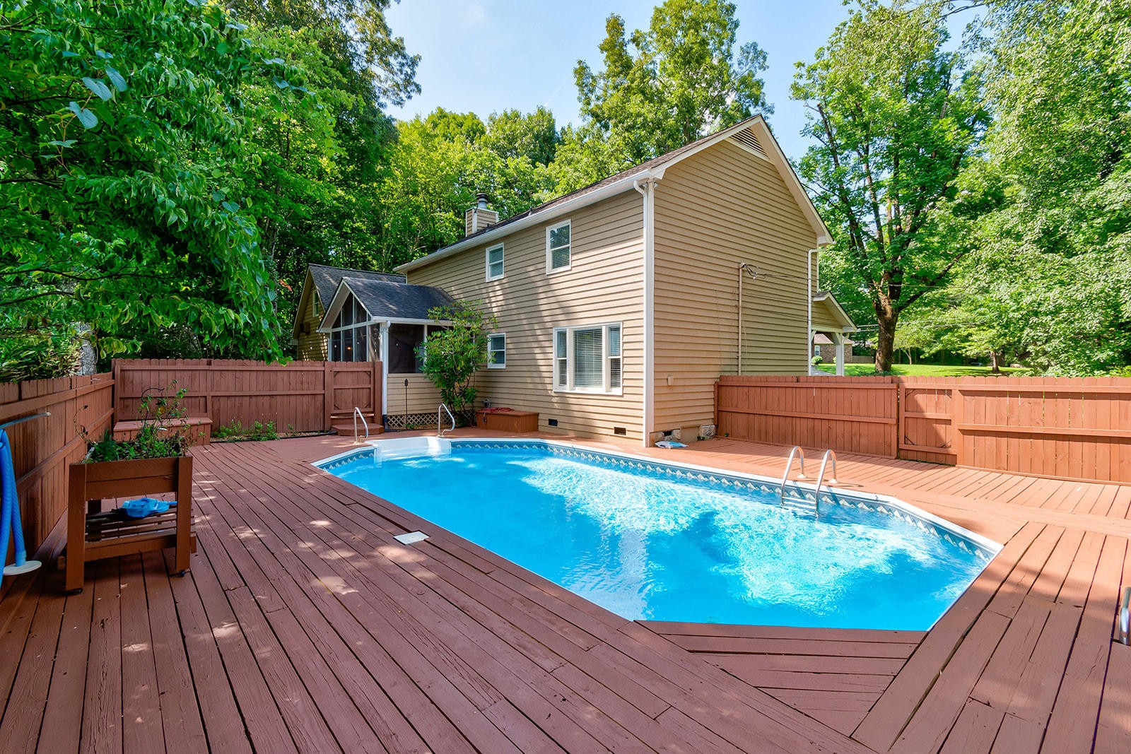 502 Rolling Creek Road Knoxville, TN 37934 - Photo 25 of 27 a view of a wooden deck and a patio with swimming pool