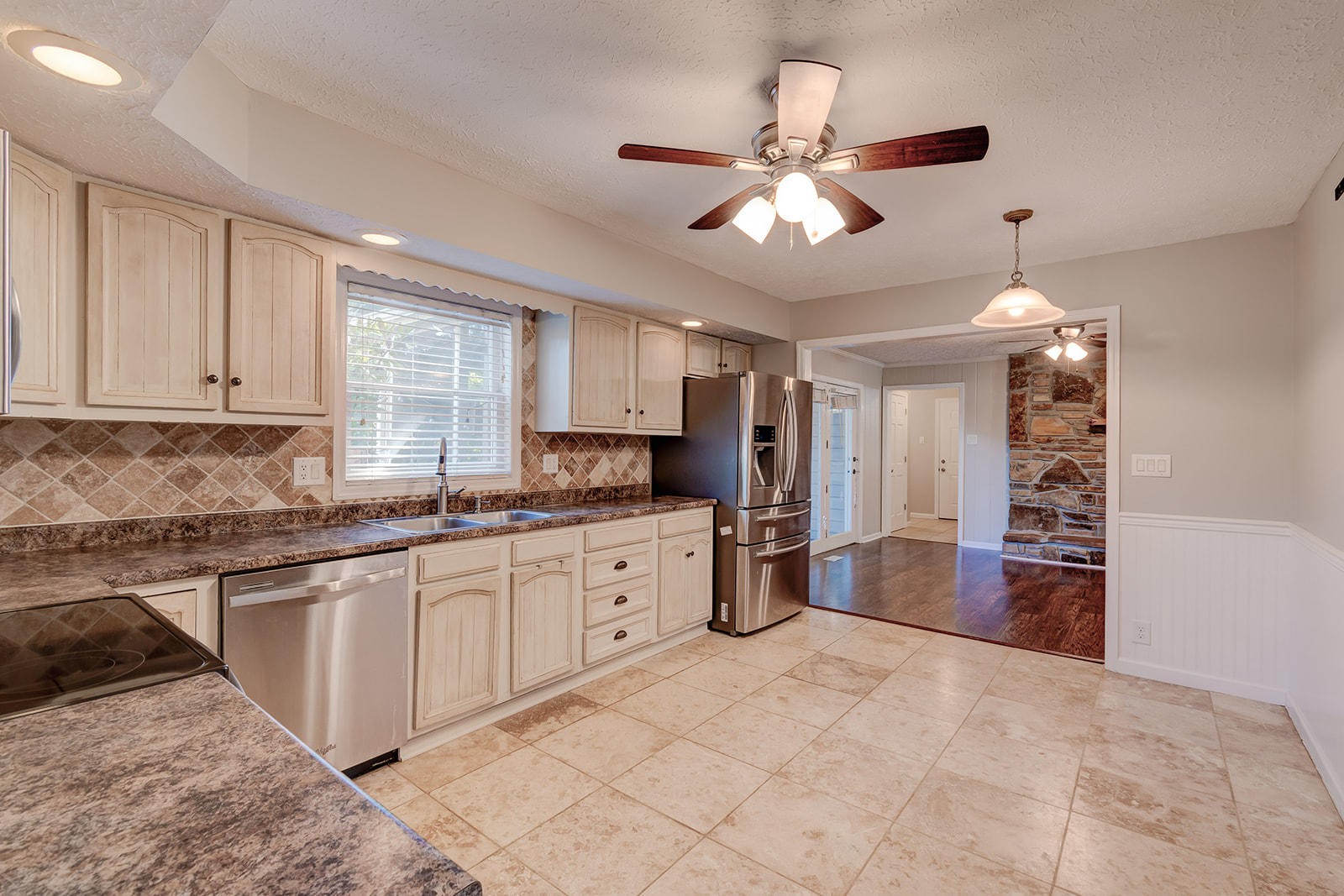 502 Rolling Creek Road Knoxville, TN 37934 - Photo 7 of 27 a large kitchen with cabinets and wooden floor