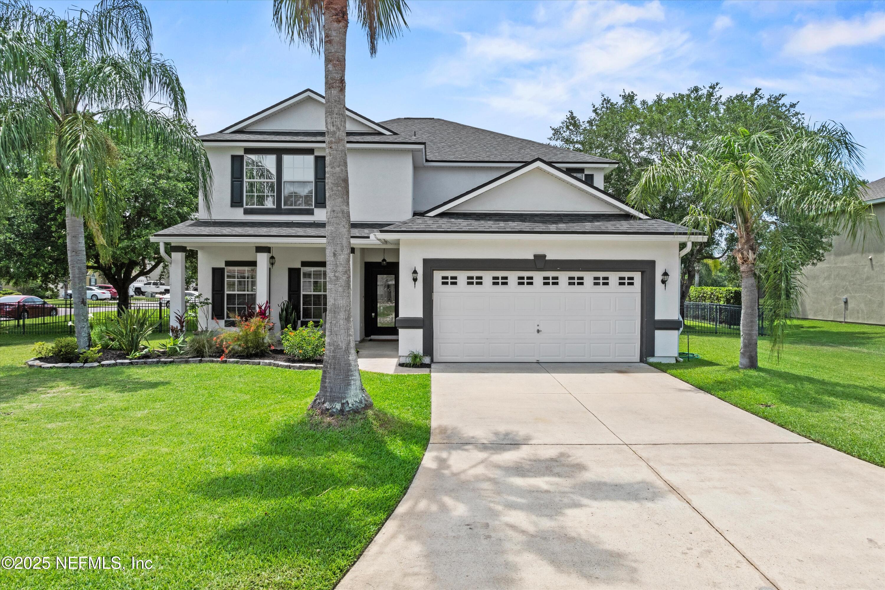 a view of house with garden