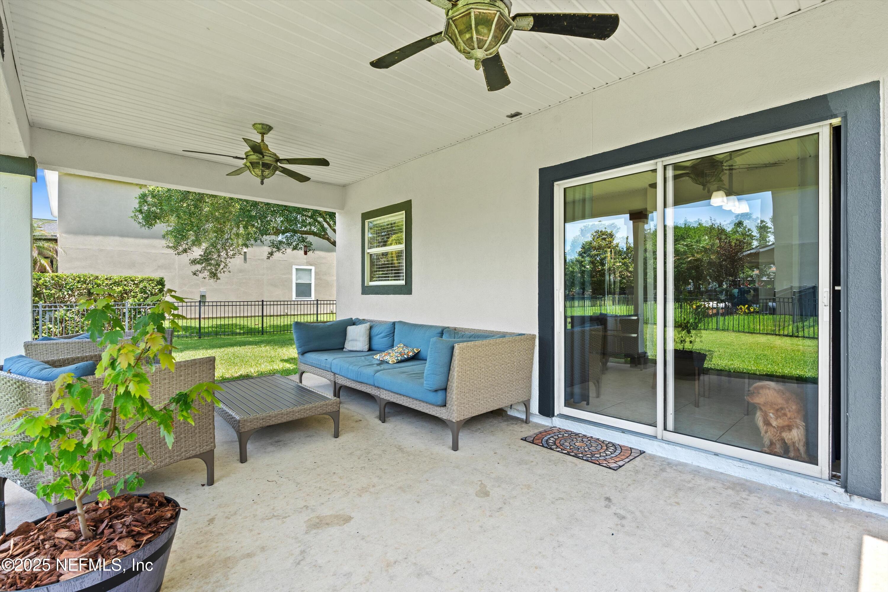 2360 Golfview Drive Fleming Island, FL 32003 - Photo 14 of 60 a living room with furniture and a large window