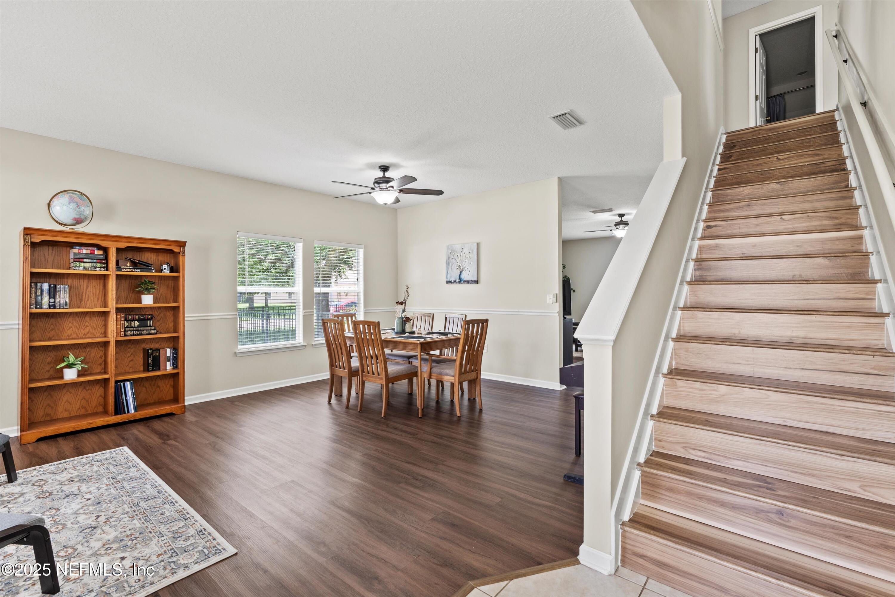 2360 Golfview Drive Fleming Island, FL 32003 - Photo 15 of 60 a view of a livingroom with furniture and staircase
