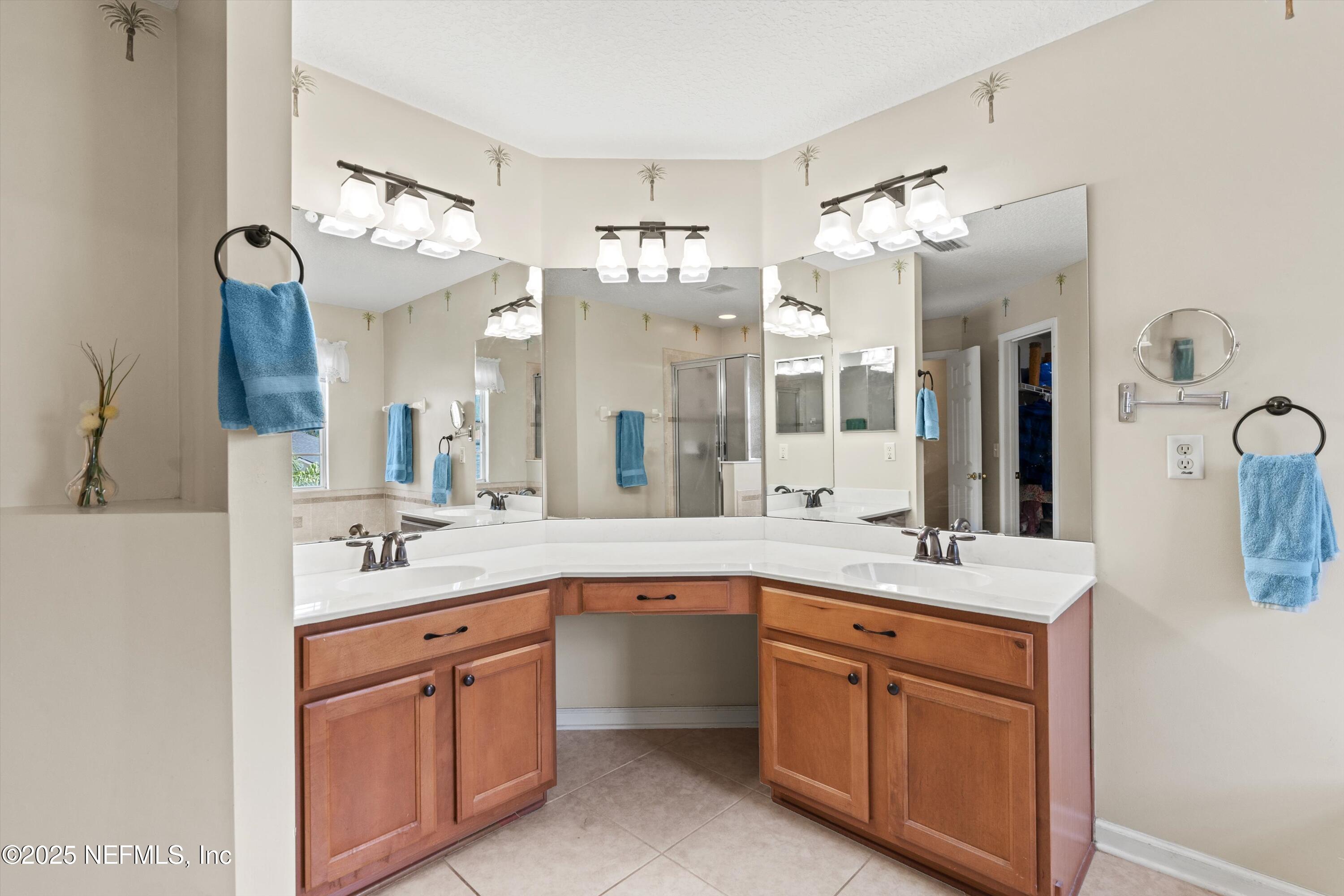 2360 Golfview Drive Fleming Island, FL 32003 - Photo 18 of 60 a spacious bathroom with a double vanity sink mirror and double