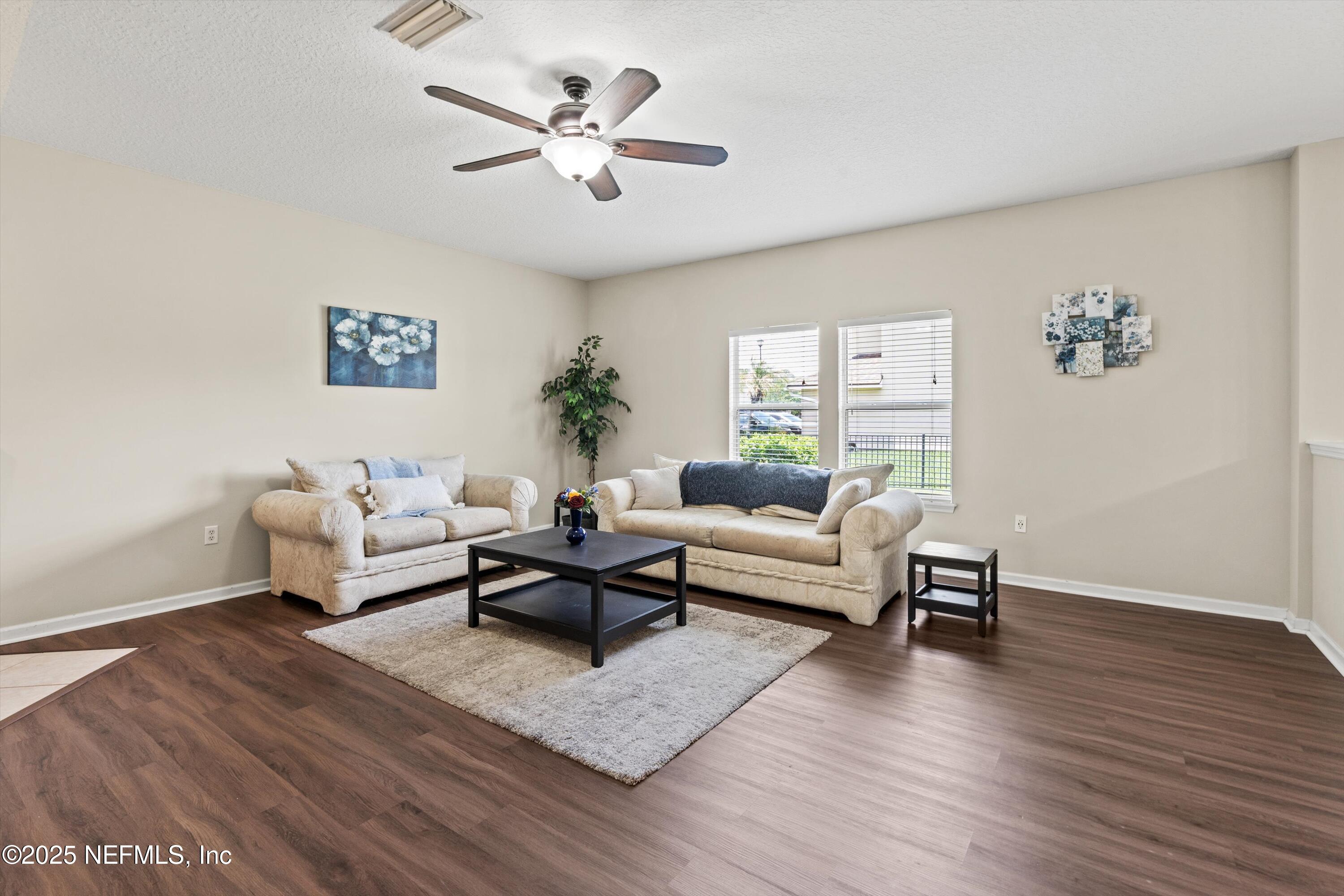 2360 Golfview Drive Fleming Island, FL 32003 - Photo 31 of 60 a living room with furniture and a wooden floor