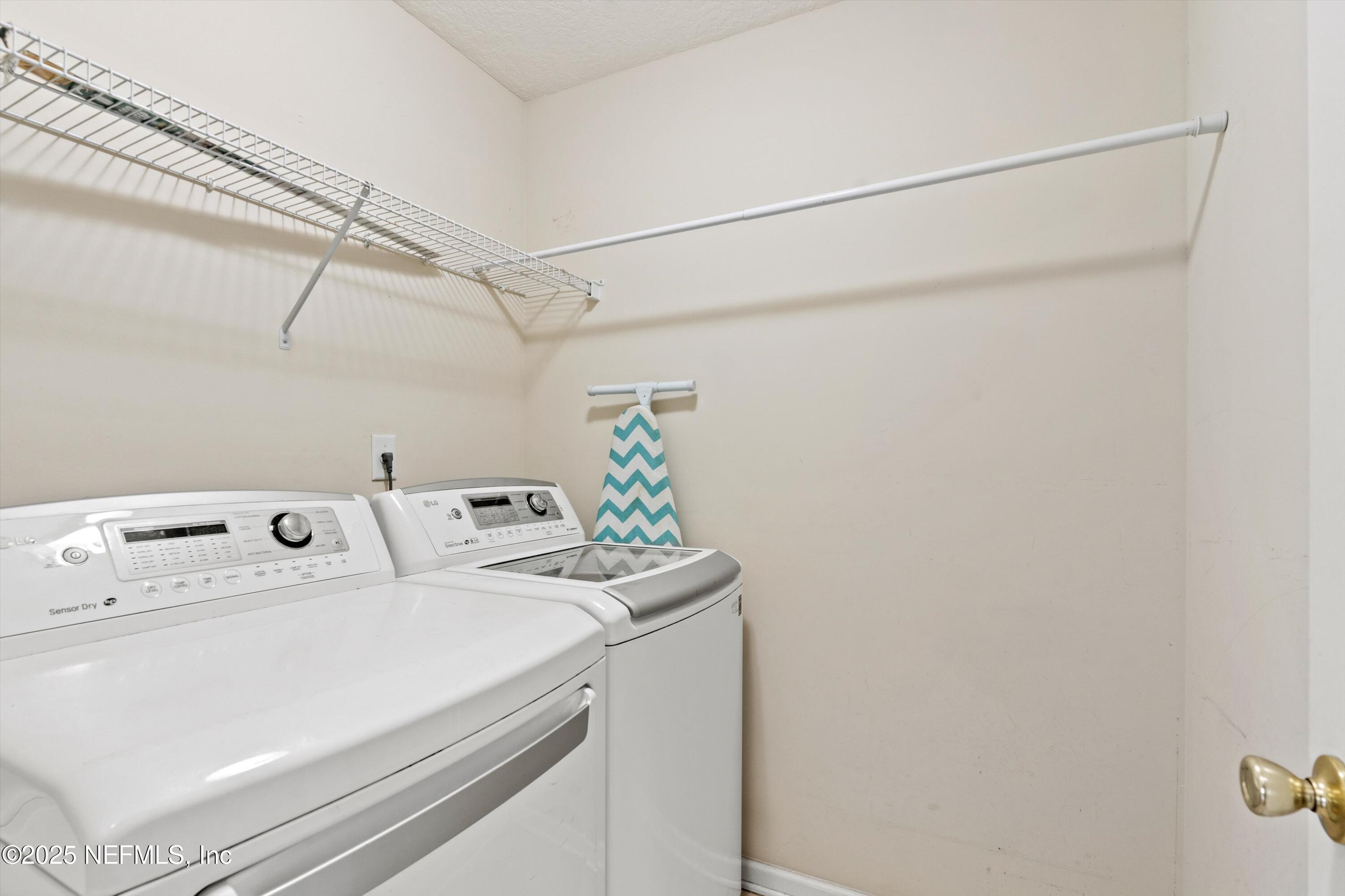 2360 Golfview Drive Fleming Island, FL 32003 - Photo 36 of 60 a utility room with dryer and washer