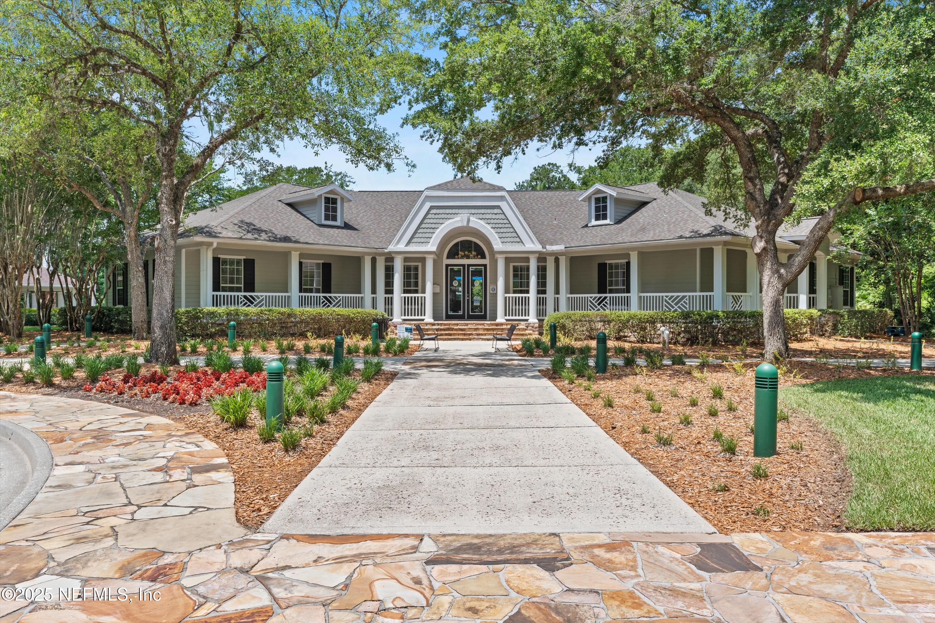 2360 Golfview Drive Fleming Island, FL 32003 - Photo 45 of 60 a front view of a house with a garden and pathway