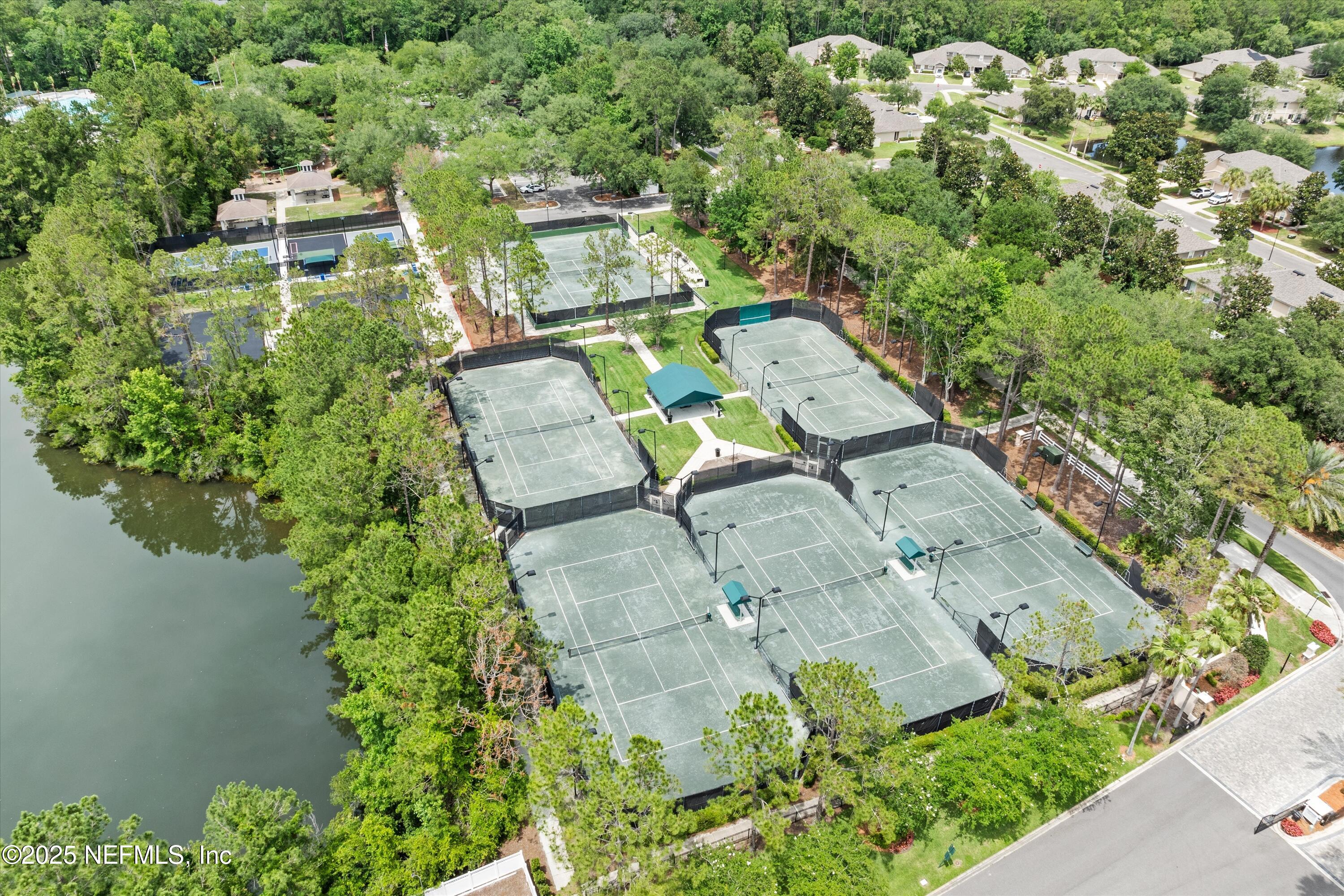 2360 Golfview Drive Fleming Island, FL 32003 - Photo 52 of 60 an aerial view of a house with a yard and lake view