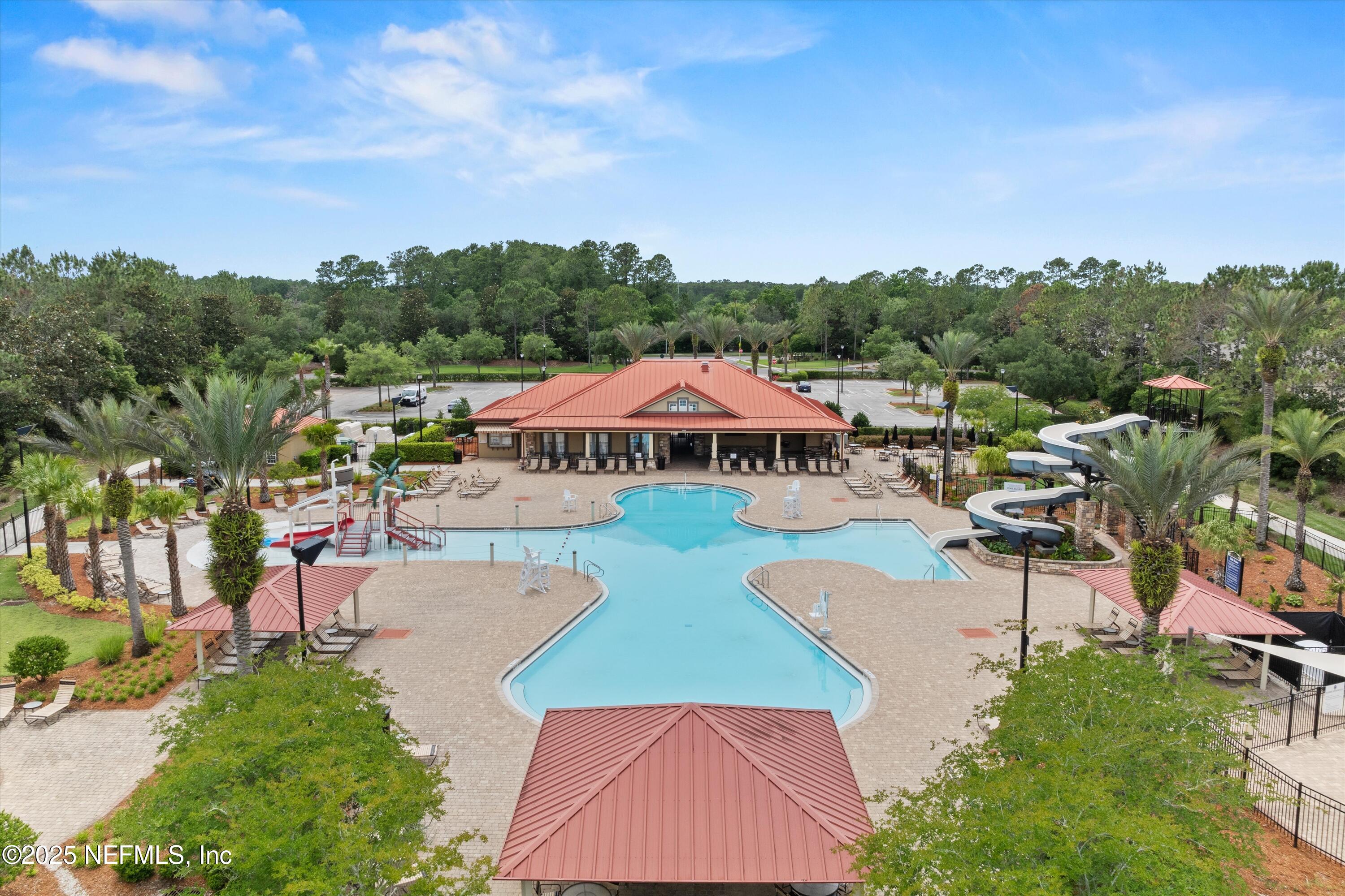 2360 Golfview Drive Fleming Island, FL 32003 - Photo 60 of 60 a view of swimming pool with outdoor seating and trees in the background