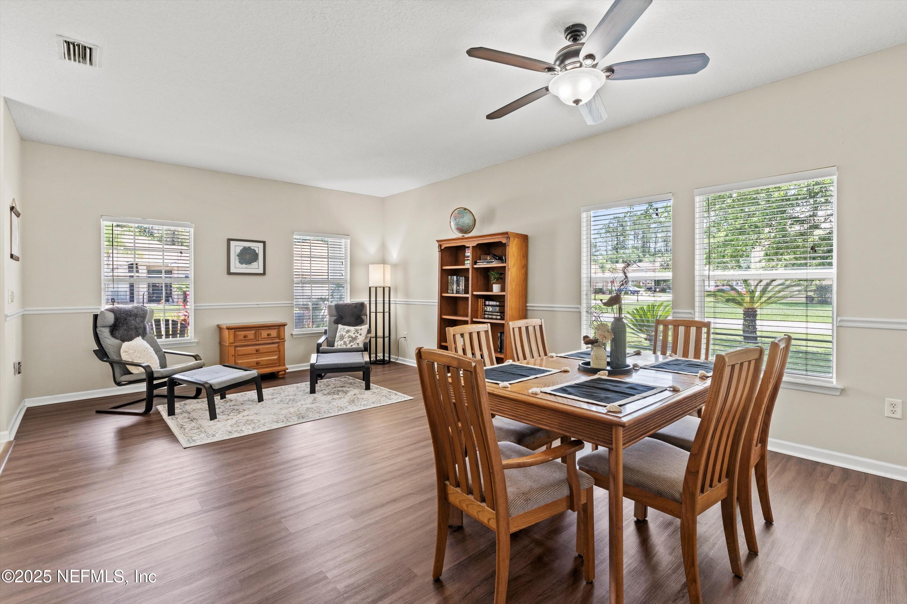 2360 Golfview Drive Fleming Island, FL 32003 - Photo 6 of 60 a dining room with furniture window and wooden floor
