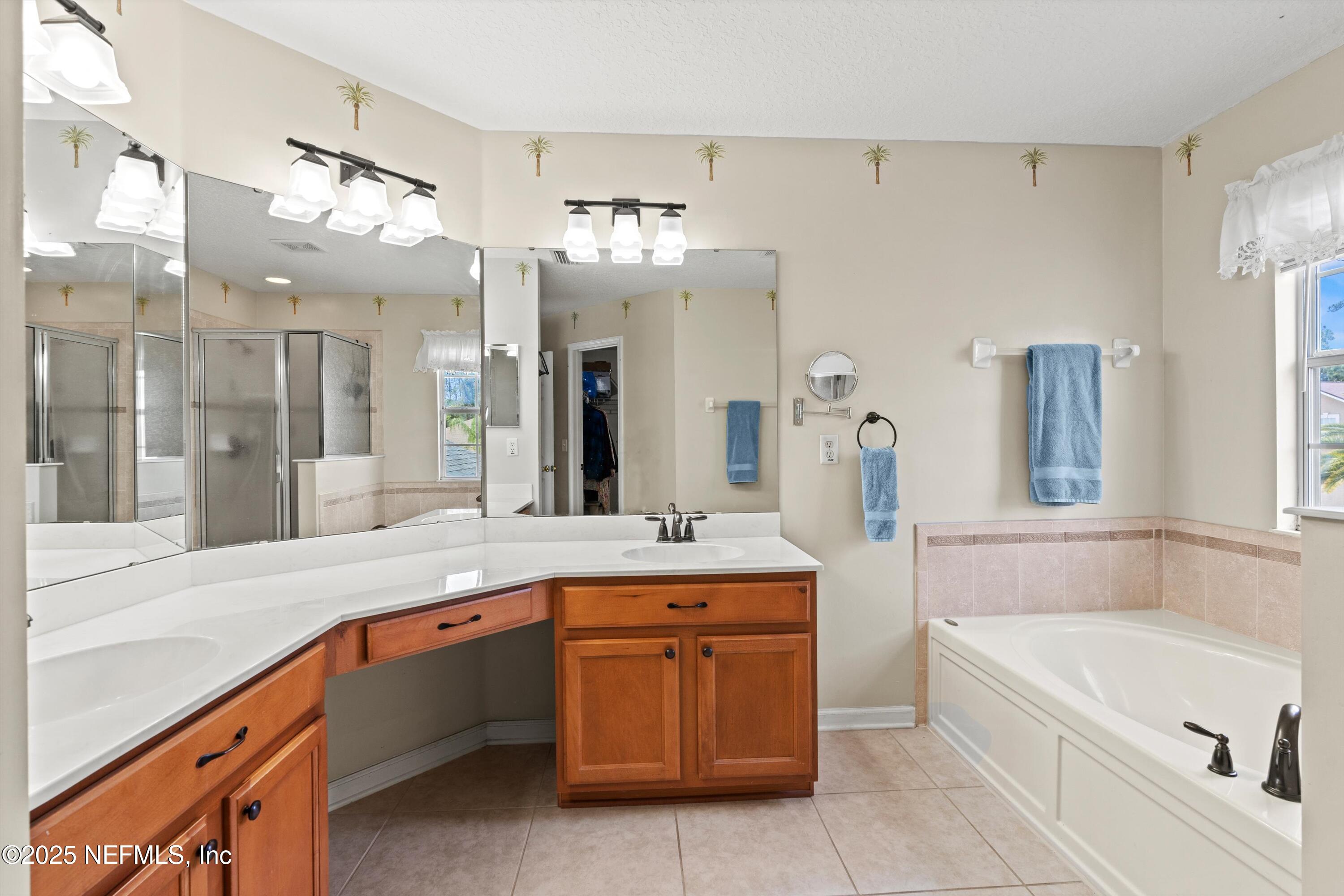 2360 Golfview Drive Fleming Island, FL 32003 - Photo 8 of 60 a spacious bathroom with a tub sink and mirror