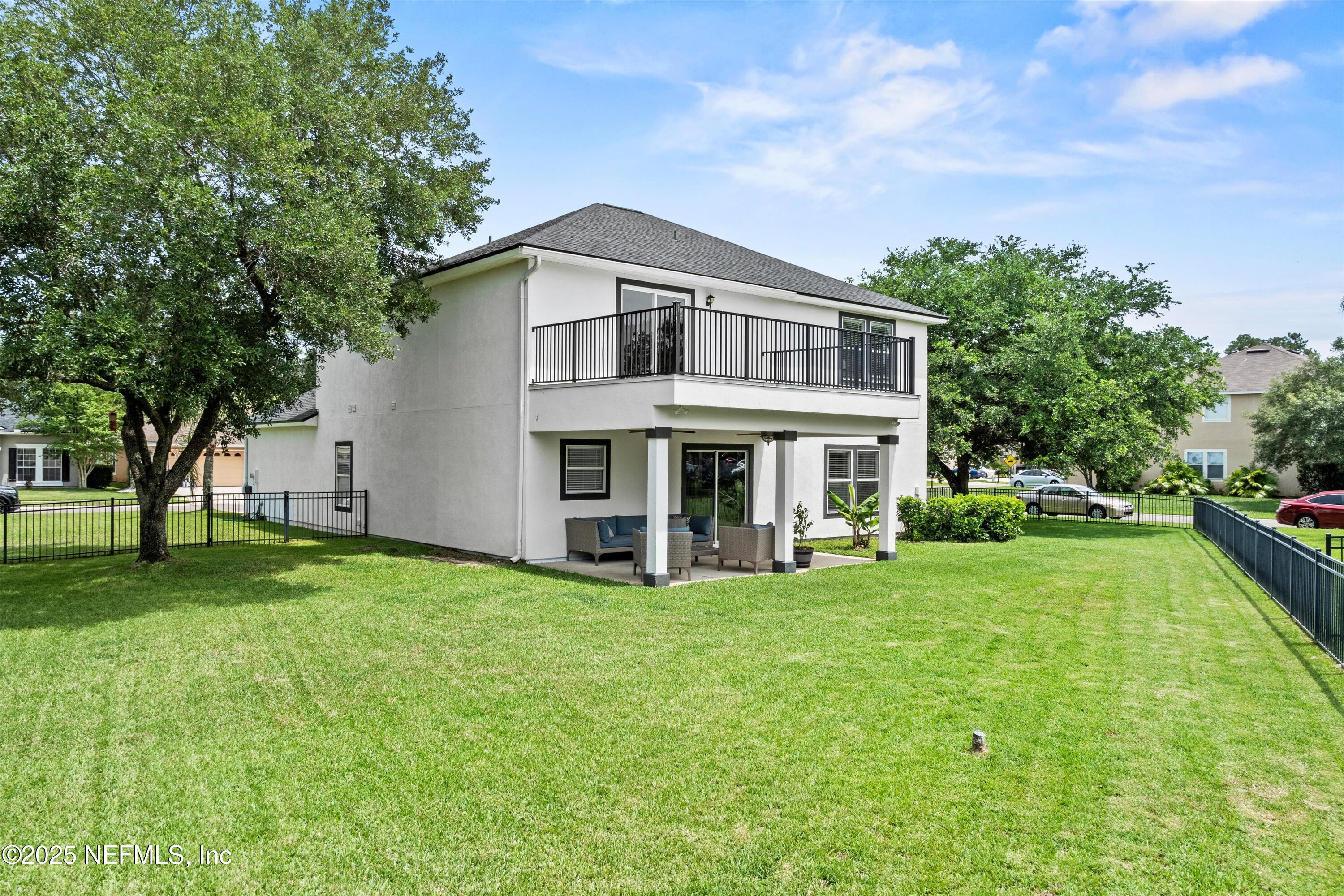 2360 Golfview Drive Fleming Island, FL 32003 - Photo 10 of 60 a view of a house with a big yard and large trees