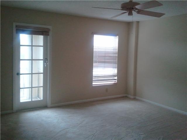 950 Ponce De Leon Road, Unit 412 Boca Raton, FL 33432 - Photo 6 of 6 an empty room with a window and a fan