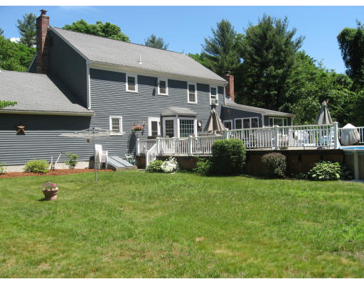 7 Saddle Hill Road Hopkinton, MA 01748 - Photo 16 of 19 a front view of a house with a yard