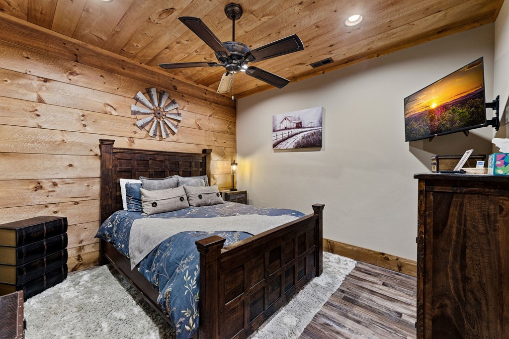 287 Scouts Overlook Lane Morganton, GA 30560 - Photo 64 of 84 a bedroom with a bed and a flat screen tv