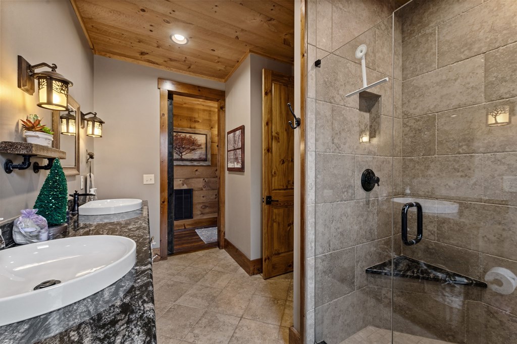 287 Scouts Overlook Lane Morganton, GA 30560 - Photo 66 of 84 a bathroom with a tub and a shower