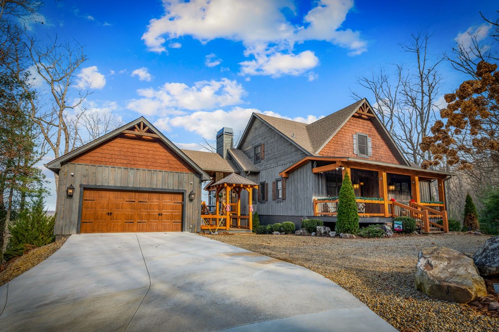287 Scouts Overlook Lane Morganton, GA 30560 - Photo 80 of 84 a front view of a house with a yard and garage