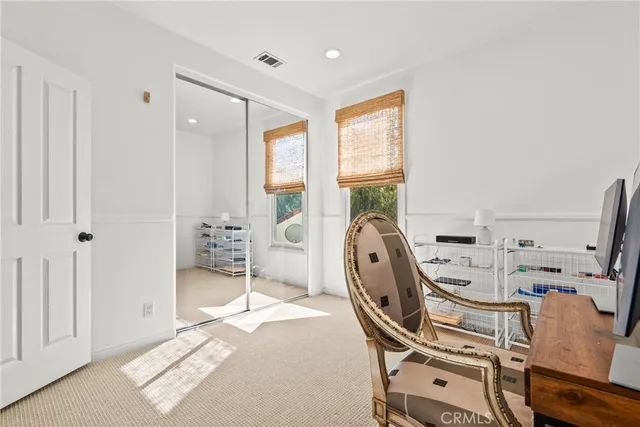 a bedroom with a bed and a fireplace