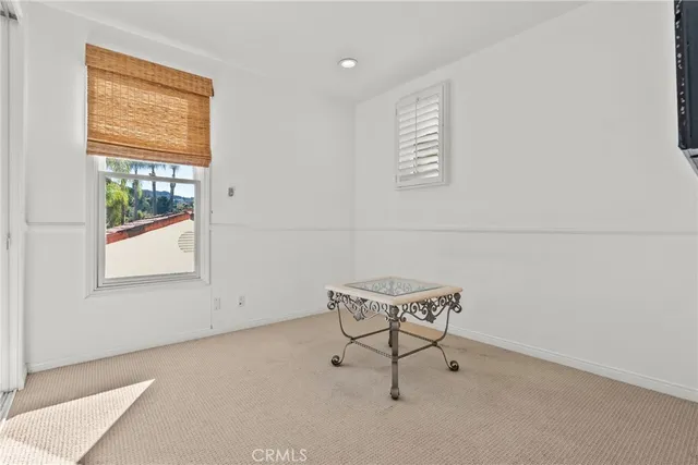 a bathroom with a granite countertop sink mirror and a large window