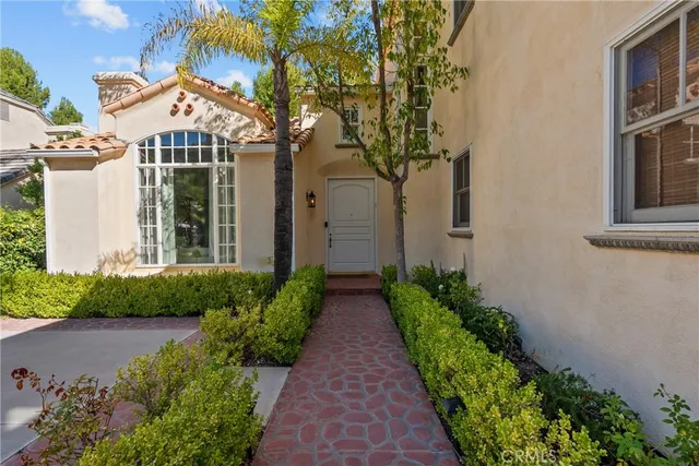 a living room with furniture fireplace and flat screen tv