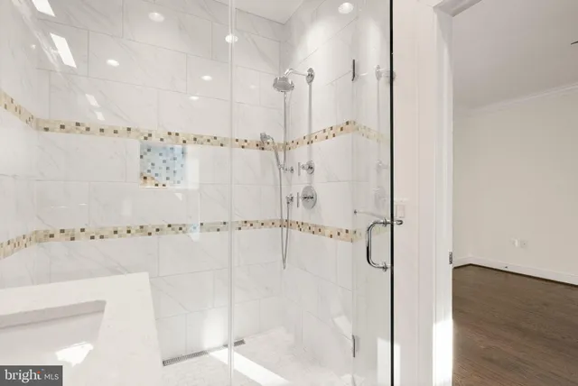 a bathroom with a toilet a sink and shower