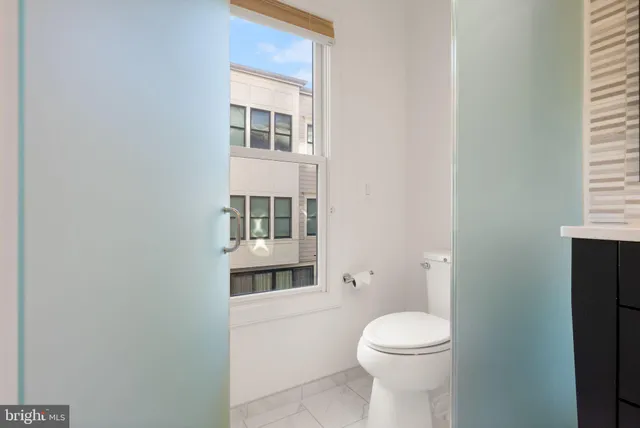 a view of walk in closet with wooden floor