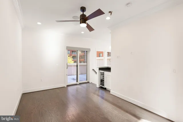 a view of a building with a lot of windows and chairs