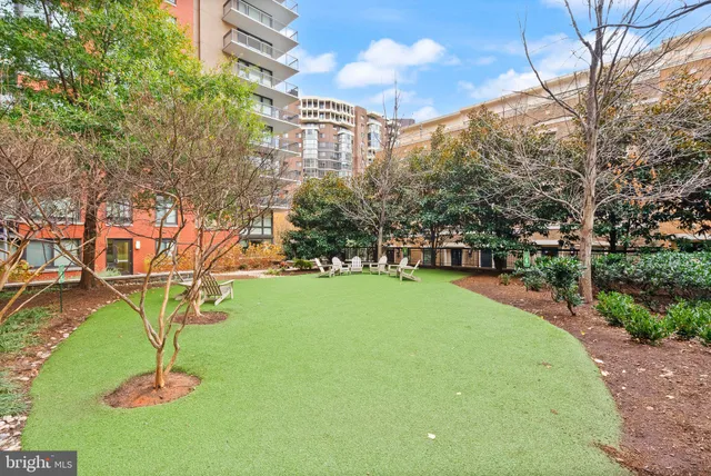 a table and chairs sitting in front of a building