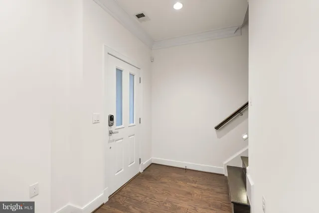 an empty room with a empty space and a window