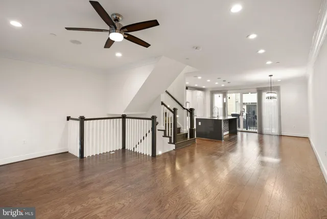 a large kitchen with a table and chairs in it