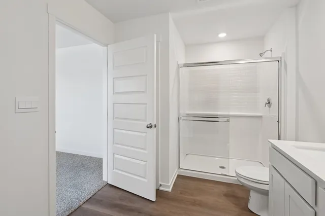 a bathroom with a shower and a sink