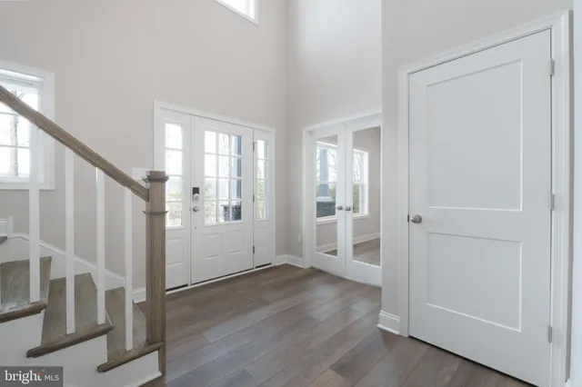 a kitchen with stainless steel appliances a sink a stove a refrigerator and center island