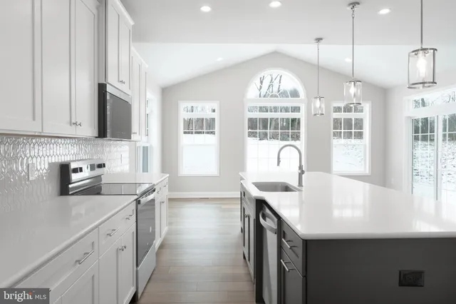 a view of hallway with wooden floor