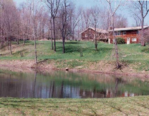 19-21 Taber Road Sherman, CT 06784 - Photo 1 of 1 a backyard of a house with lots of green space