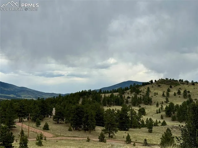 a view of mountains and valleys