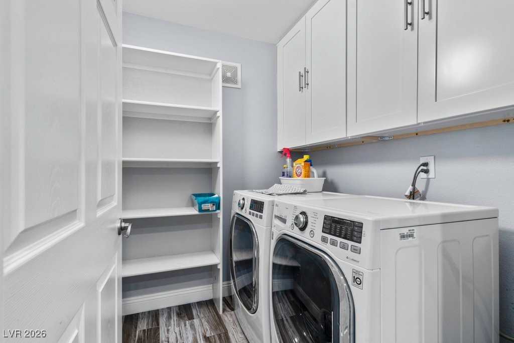7885 West Flamingo Road, Unit 1053 Las Vegas, NV 89147 - Photo 11 of 33 Laundry room with cabinet space, separate washer and dryer, and dark wood finished floors