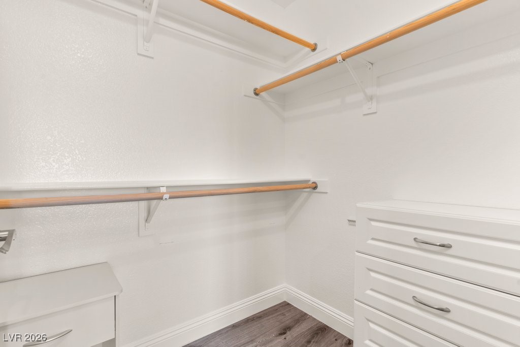 7885 West Flamingo Road, Unit 1053 Las Vegas, NV 89147 - Photo 21 of 33 Walk in closet featuring dark wood-type flooring