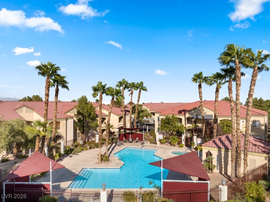 7885 West Flamingo Road, Unit 1053 Las Vegas, NV 89147 - Photo 25 of 33 Community pool with a residential view