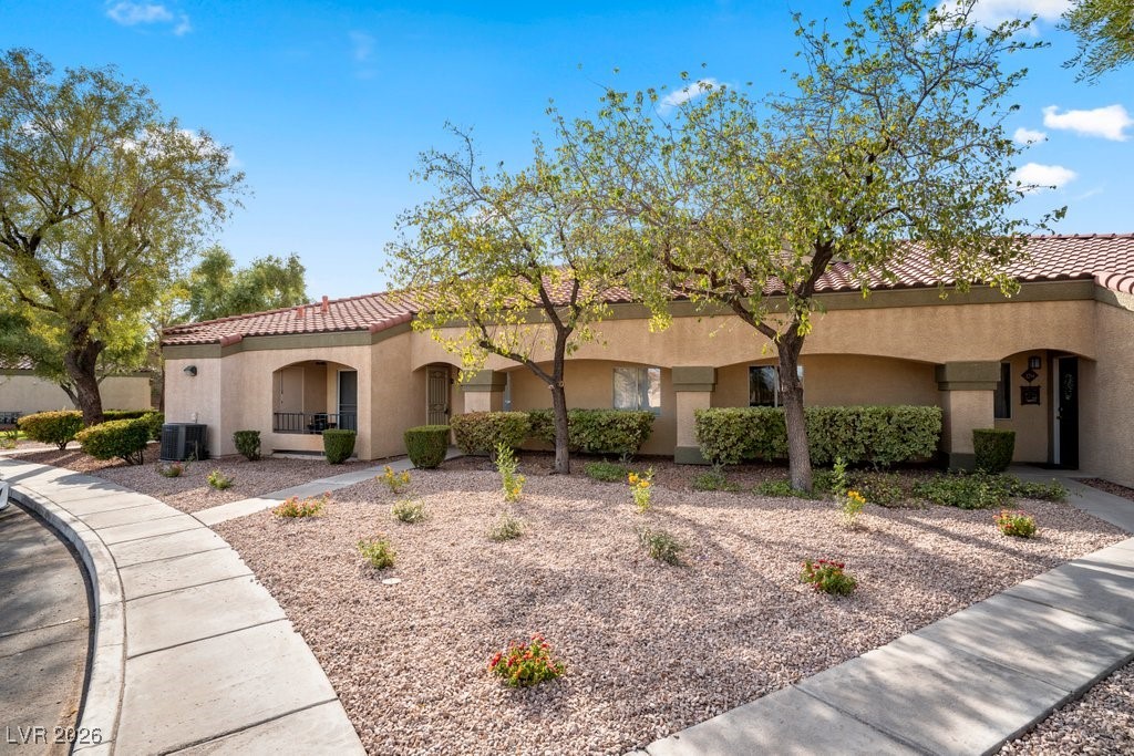 7885 West Flamingo Road, Unit 1053 Las Vegas, NV 89147 - Photo 31 of 33 Mediterranean / spanish-style house featuring stucco siding and a tiled roof
