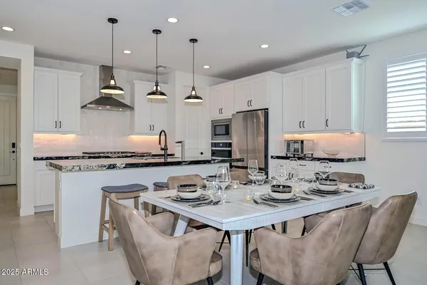 a front view of a house with a yard and a garage