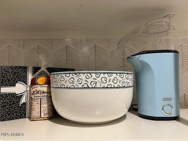 a view of a chairs and table in the patio