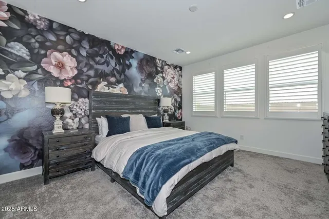 a view of a hallway with paintings on the wall